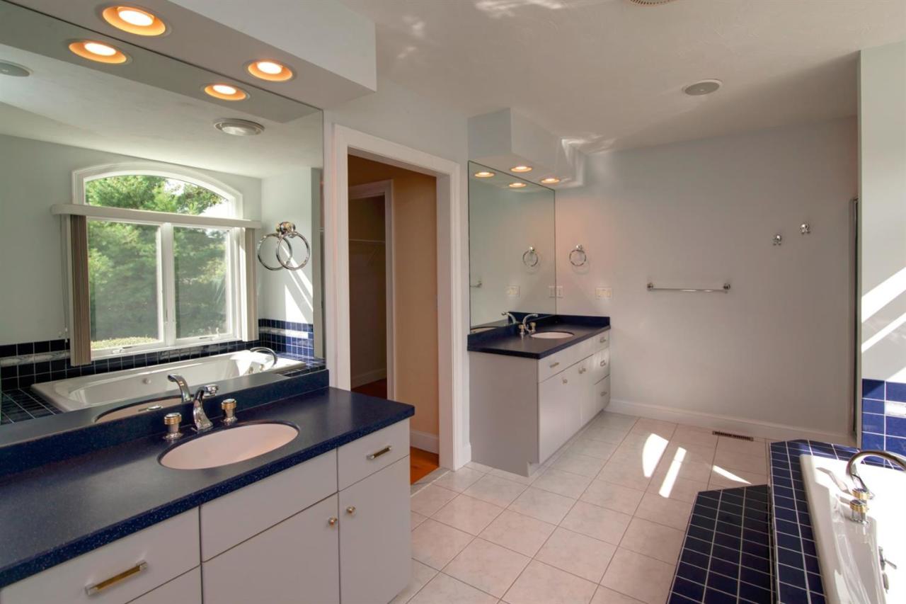 153 Cairn Ridge Road East Falmouth, MA 02536 - Photo 19 of 25 a large kitchen with granite countertop a sink stainless steel appliances and cabinets