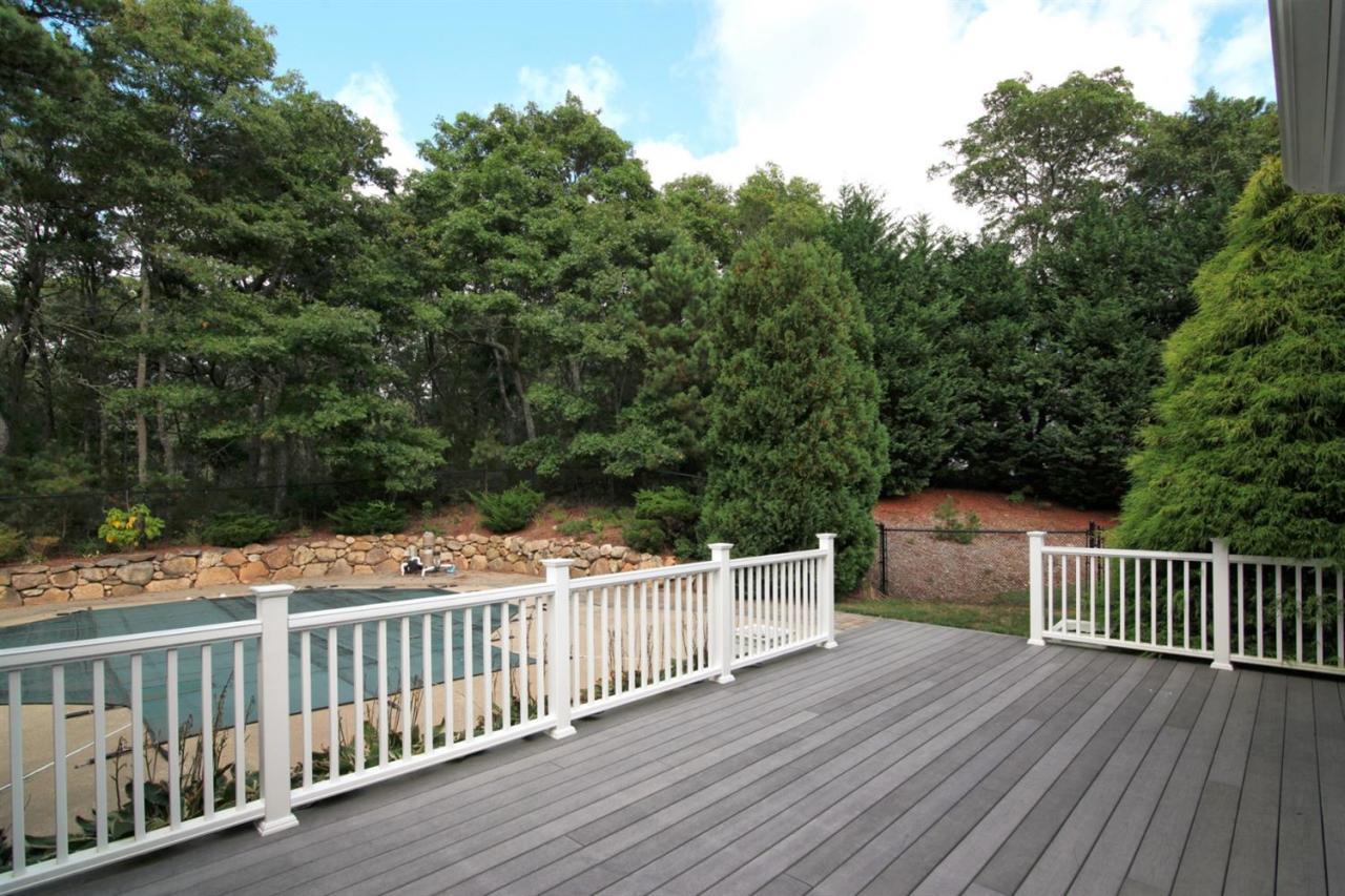 153 Cairn Ridge Road East Falmouth, MA 02536 - Photo 25 of 25 a balcony with wooden floor and fence