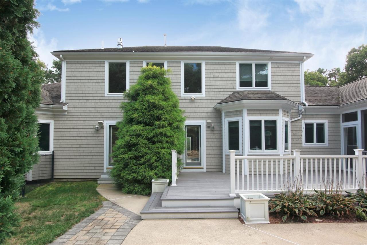 153 Cairn Ridge Road East Falmouth, MA 02536 - Photo 5 of 25 a front view of a house with garden