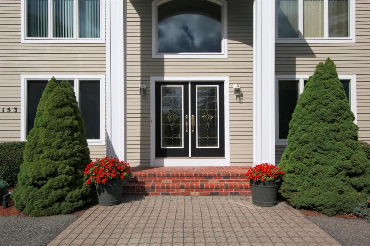 153 Cairn Ridge Road East Falmouth, MA 02536 - Photo 6 of 25 a view of a house with flower garden
