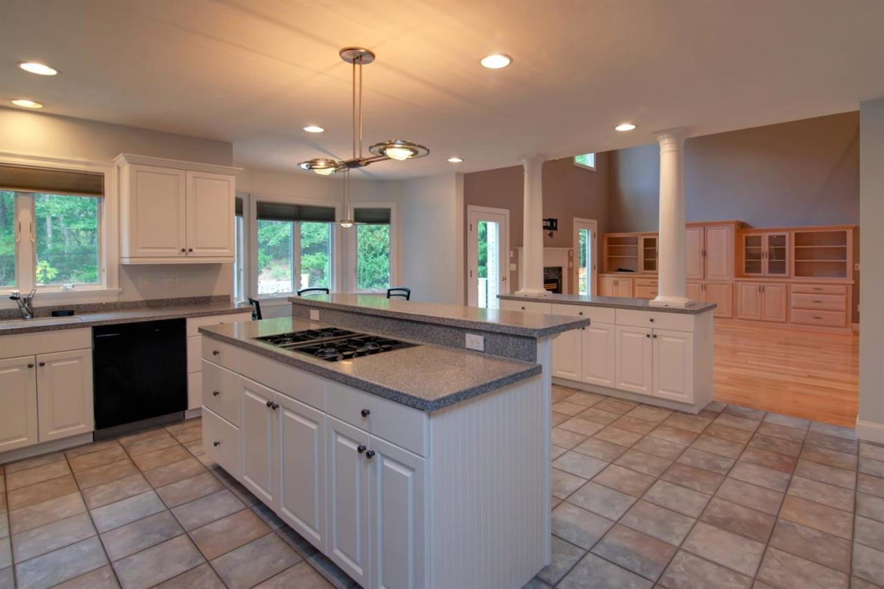 153 Cairn Ridge Road East Falmouth, MA 02536 - Photo 7 of 25 a kitchen with stainless steel appliances granite countertop a sink stove and cabinets