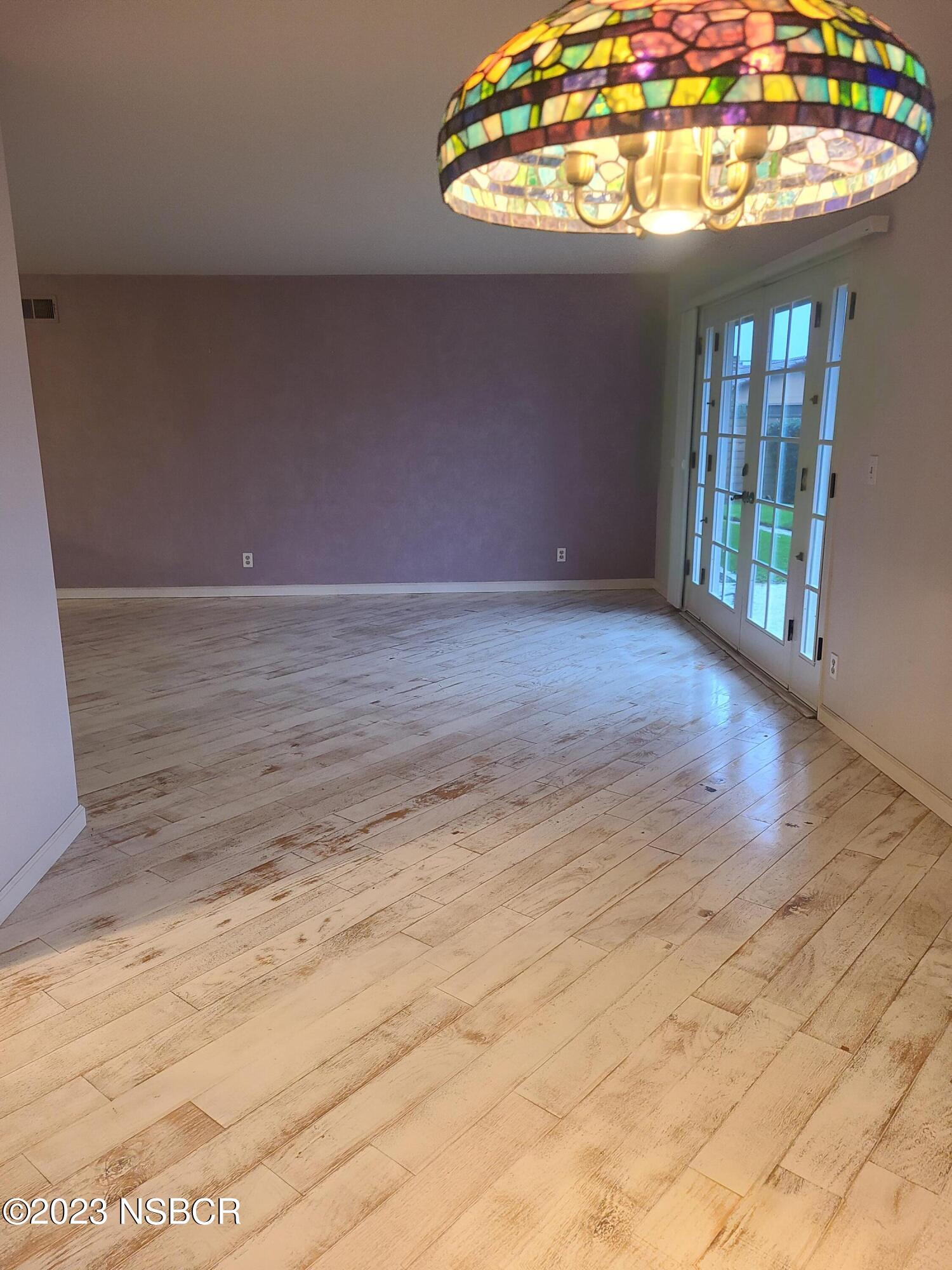 1205 North B Street Lompoc, CA 93436 - Photo 17 of 39 a view of an empty room with a window