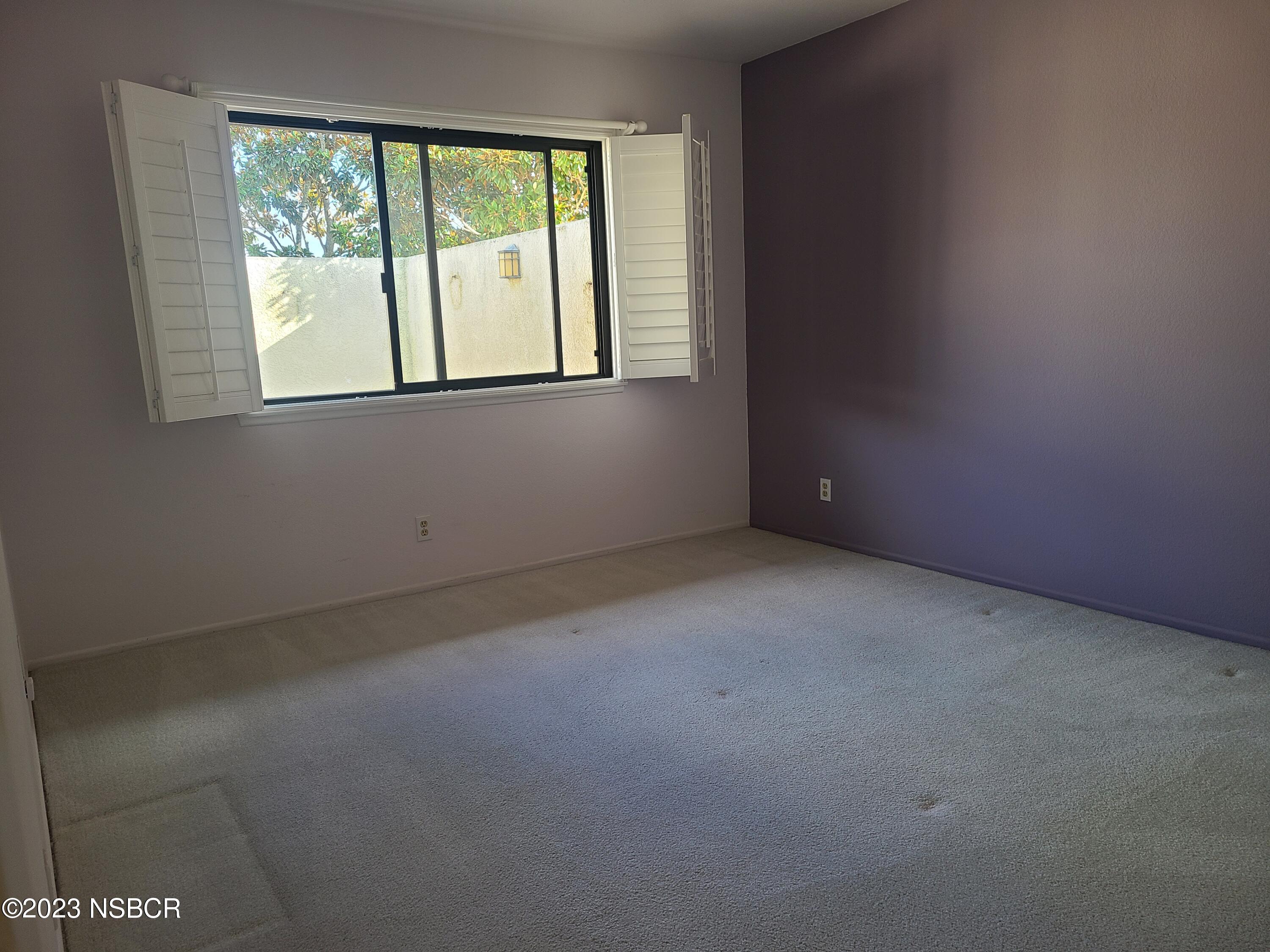 1205 North B Street Lompoc, CA 93436 - Photo 22 of 39 a view of an empty room with a window