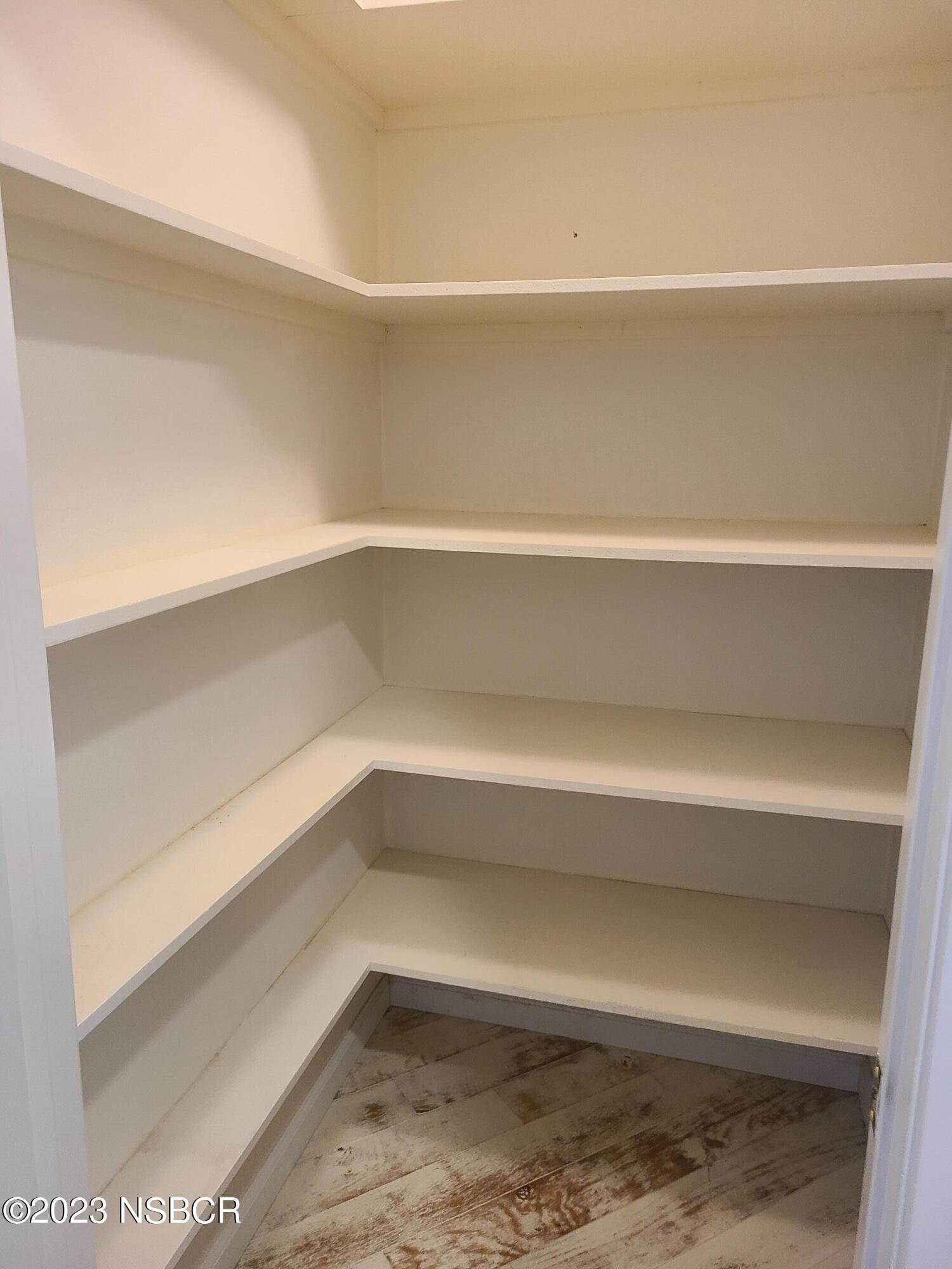 1205 North B Street Lompoc, CA 93436 - Photo 24 of 39 a view of small space with racks on the wall