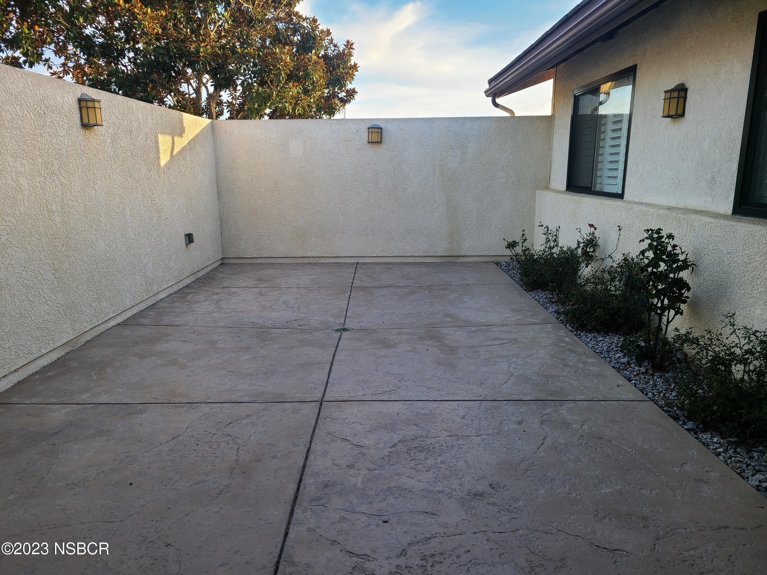 1205 North B Street Lompoc, CA 93436 - Photo 3 of 39 a view of a house with a yard