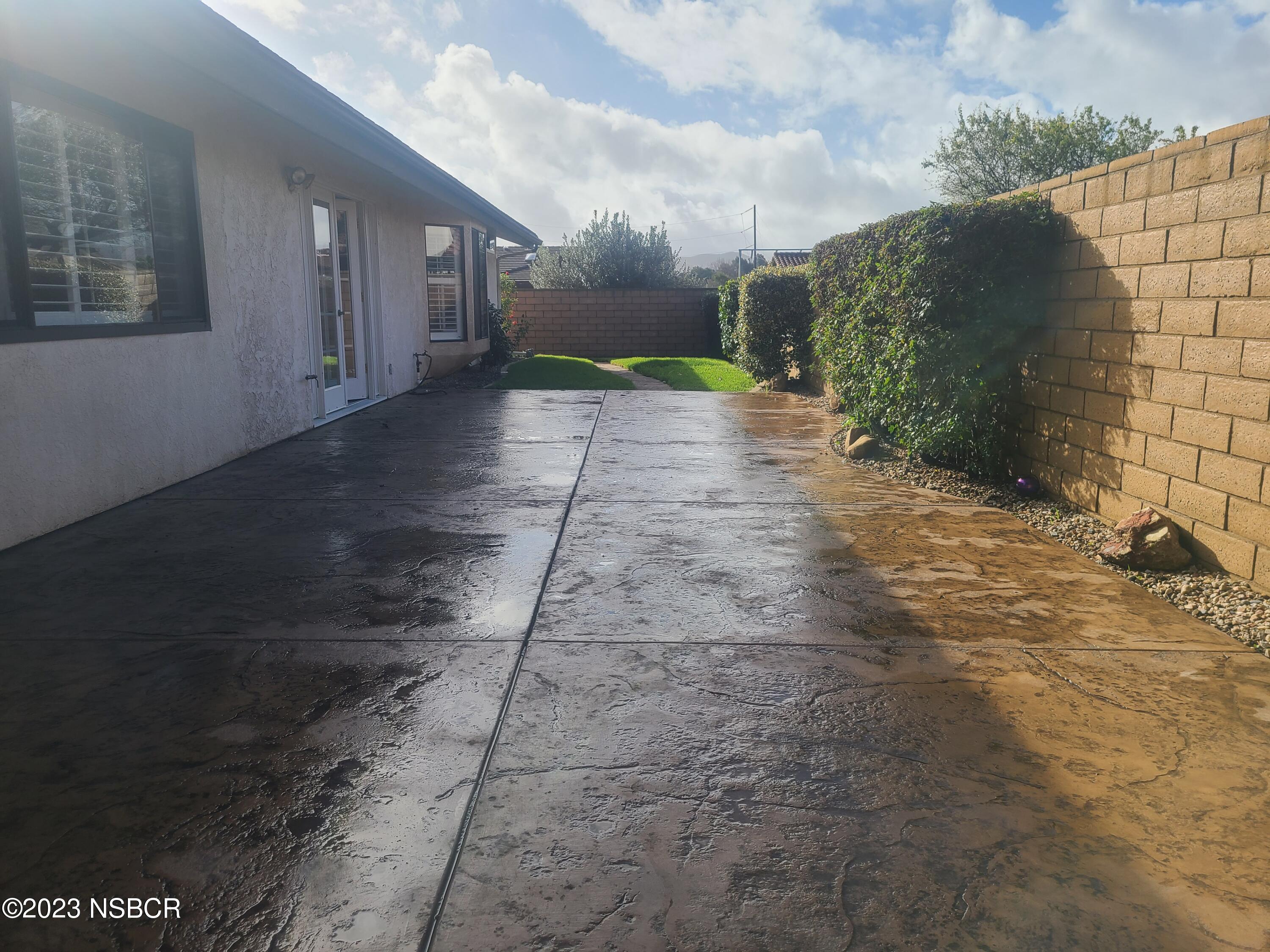 1205 North B Street Lompoc, CA 93436 - Photo 33 of 39 a view of a pathway both side of house