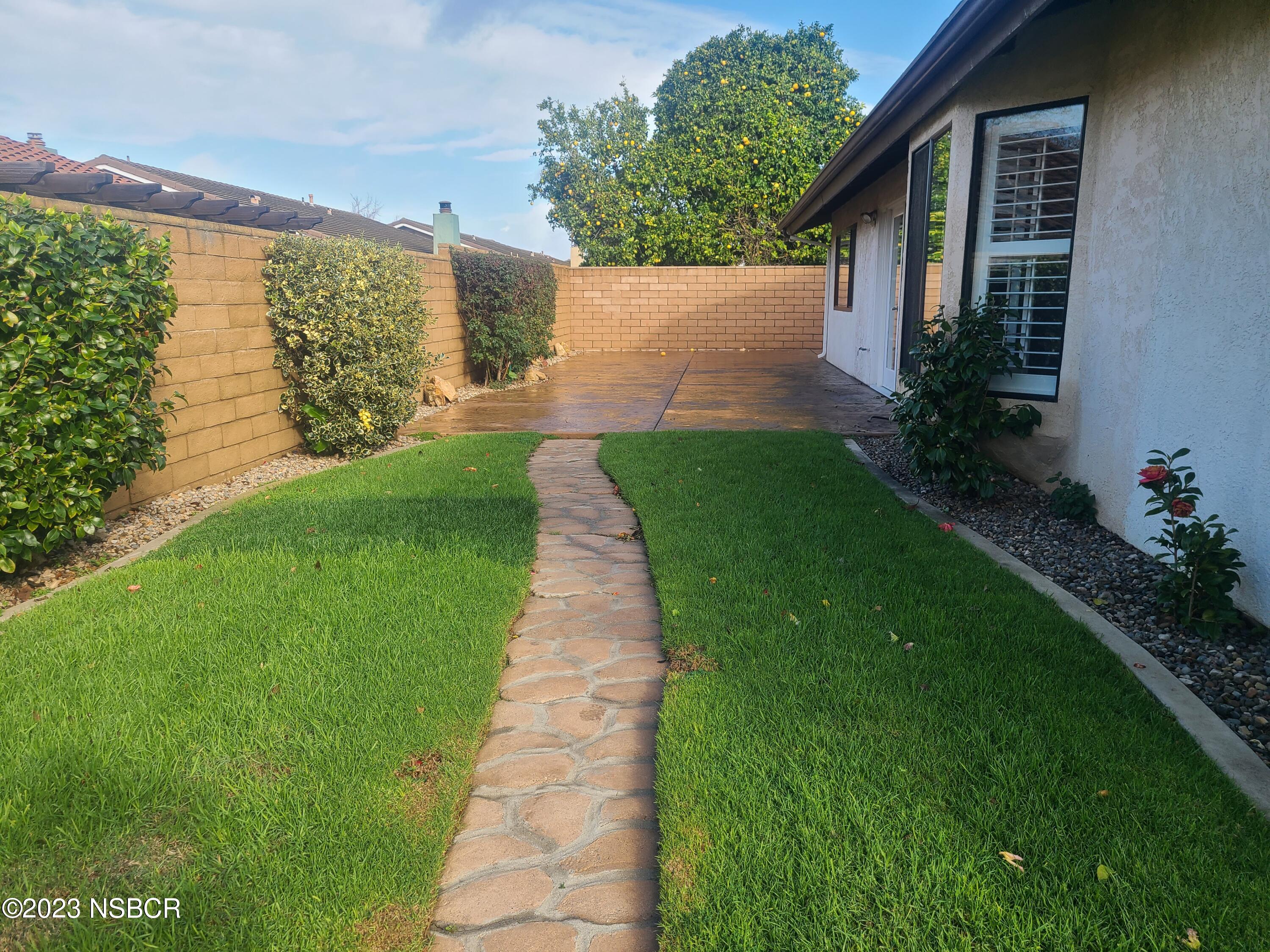 1205 North B Street Lompoc, CA 93436 - Photo 34 of 39 a view of a backyard with plants
