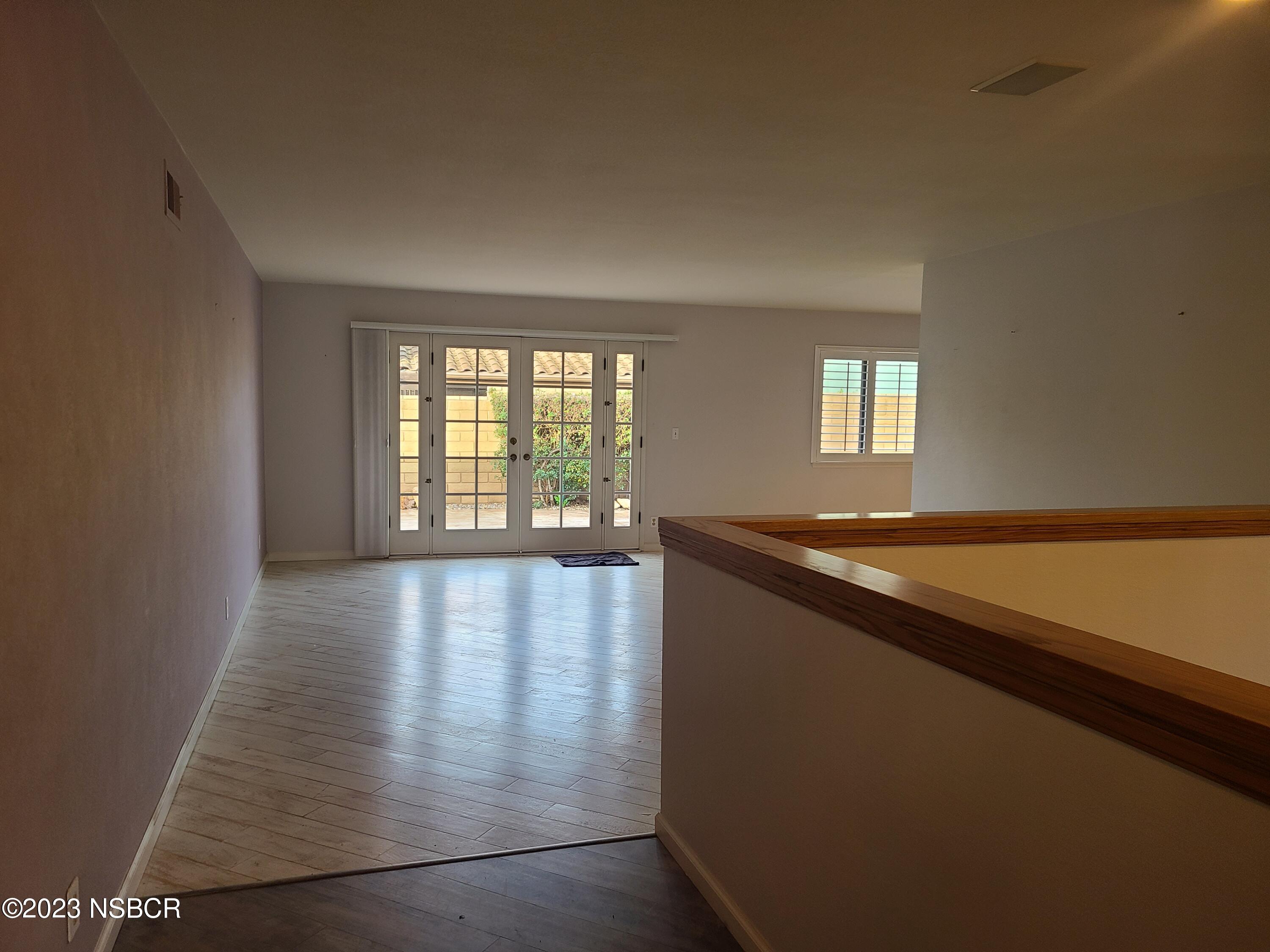 1205 North B Street Lompoc, CA 93436 - Photo 9 of 39 an empty room with windows