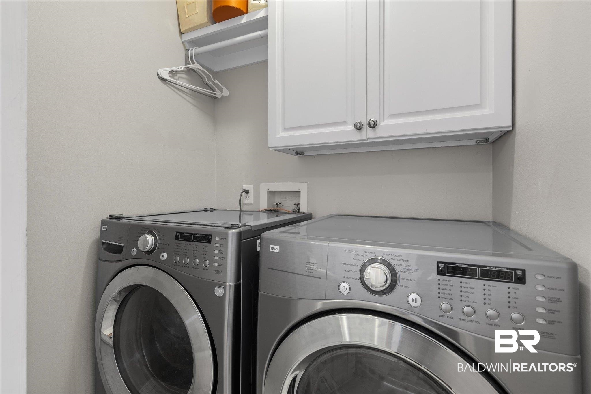 165 Crenshaw Street Mobile, AL 36606 - Photo 16 of 21 Laundry room featuring washer and dryer and cabinet space
