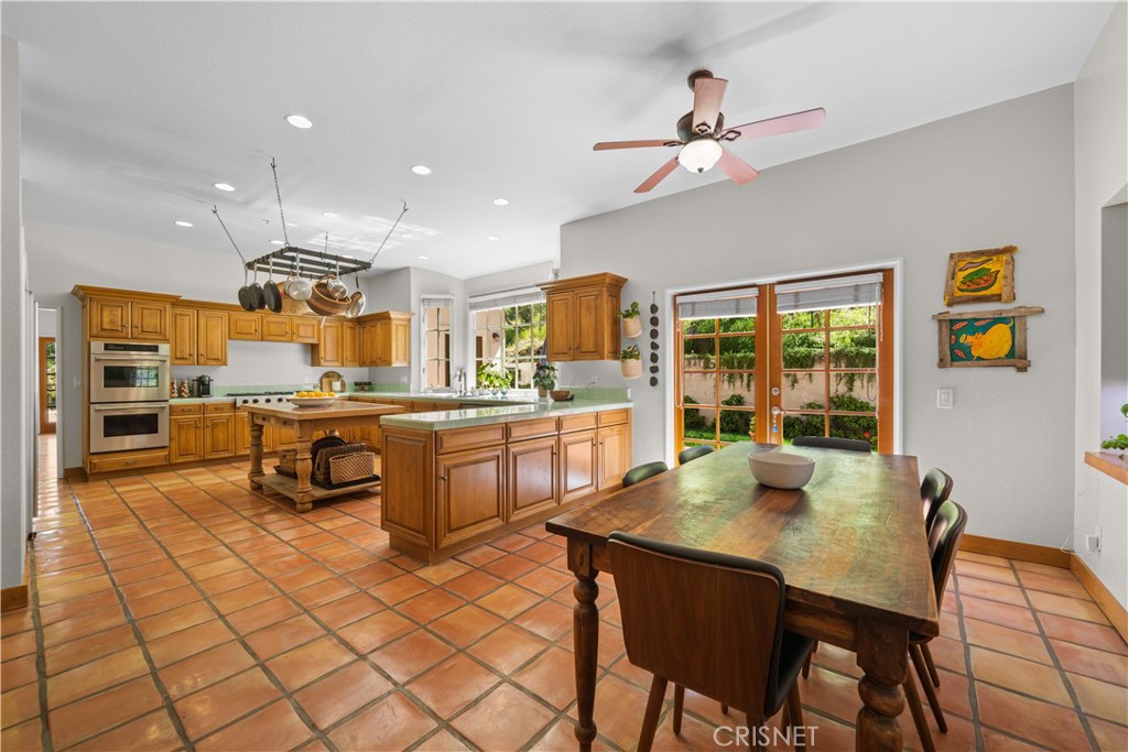 121 Saddlebow Road Bell Canyon, CA 91307 - Photo 12 of 62 a open kitchen with stainless steel appliances kitchen island granite countertop a sink and cabinets