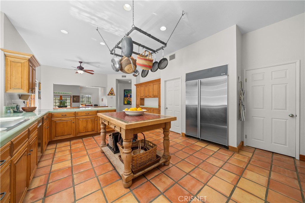 121 Saddlebow Road Bell Canyon, CA 91307 - Photo 14 of 62 a kitchen with stainless steel appliances granite countertop a stove a sink dishwasher and a refrigerator