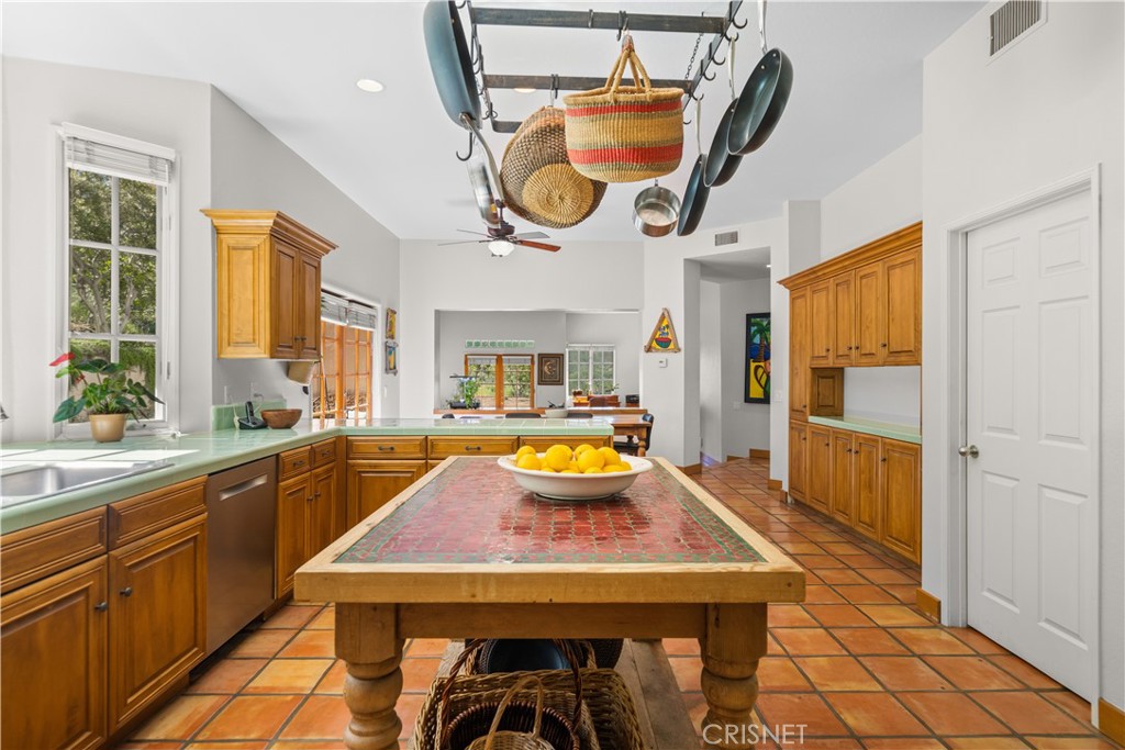 121 Saddlebow Road Bell Canyon, CA 91307 - Photo 15 of 62 a kitchen with stainless steel appliances granite countertop a sink and a refrigerator
