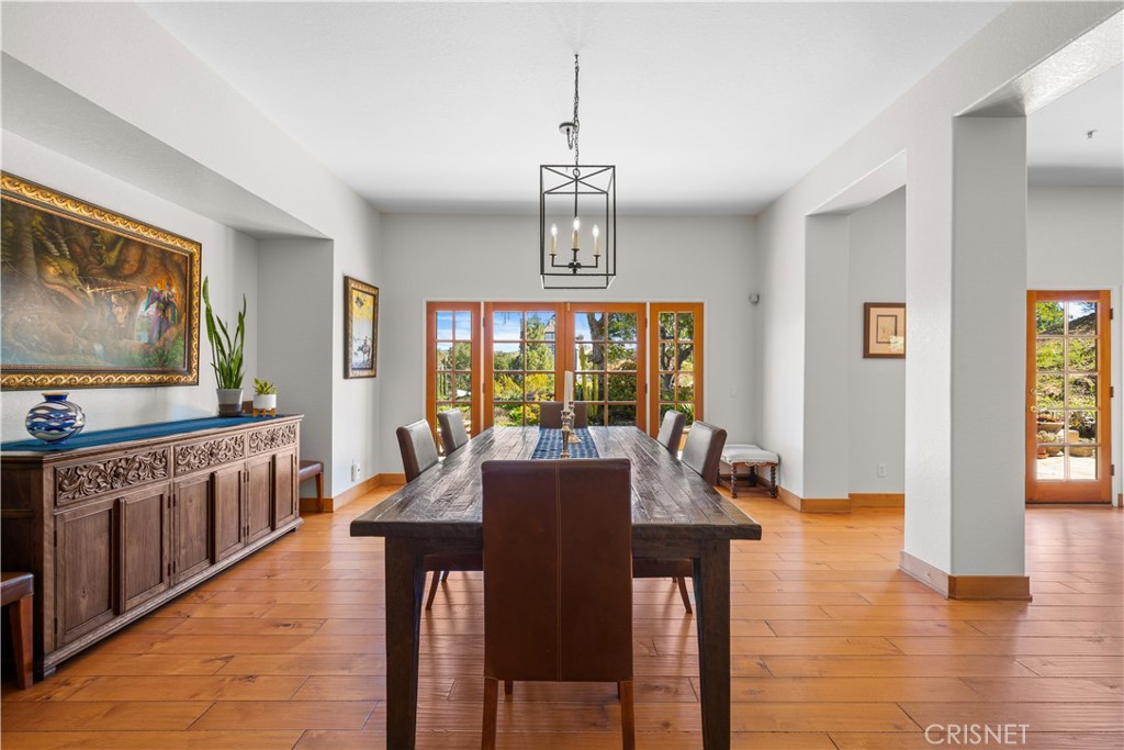 121 Saddlebow Road Bell Canyon, CA 91307 - Photo 16 of 62 a view of a dining room with furniture window and wooden floor