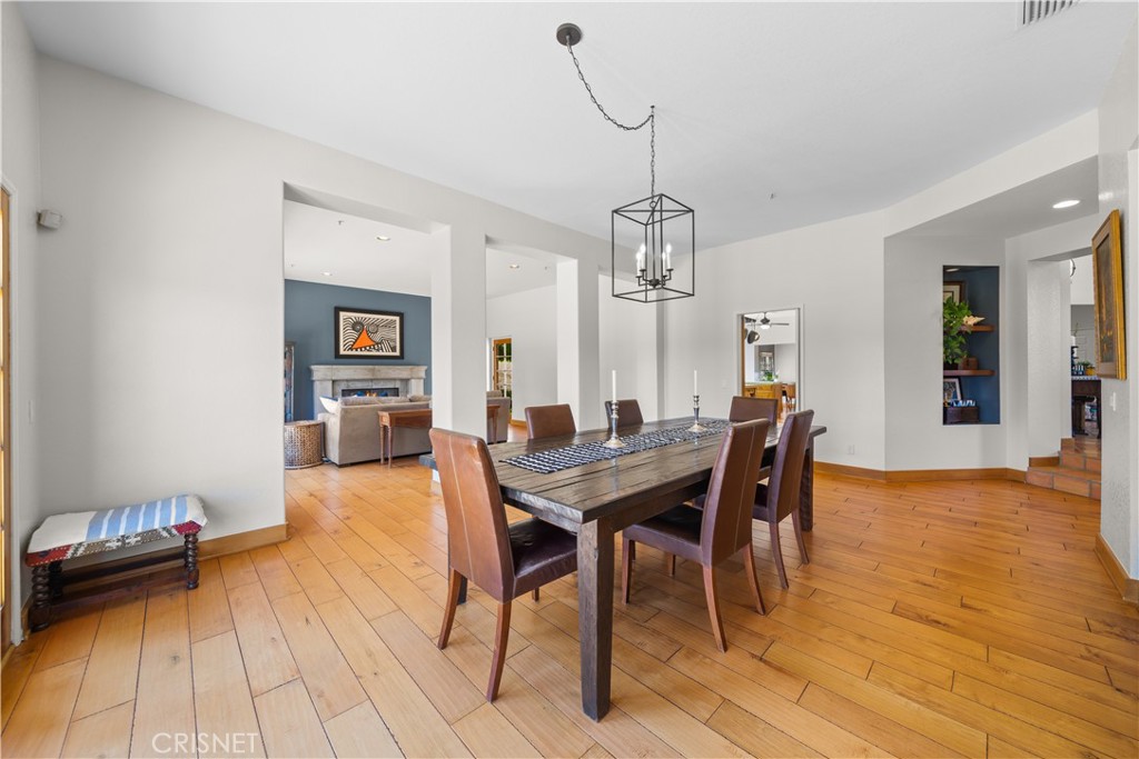 121 Saddlebow Road Bell Canyon, CA 91307 - Photo 17 of 62 a view of a dining room with furniture and wooden floor