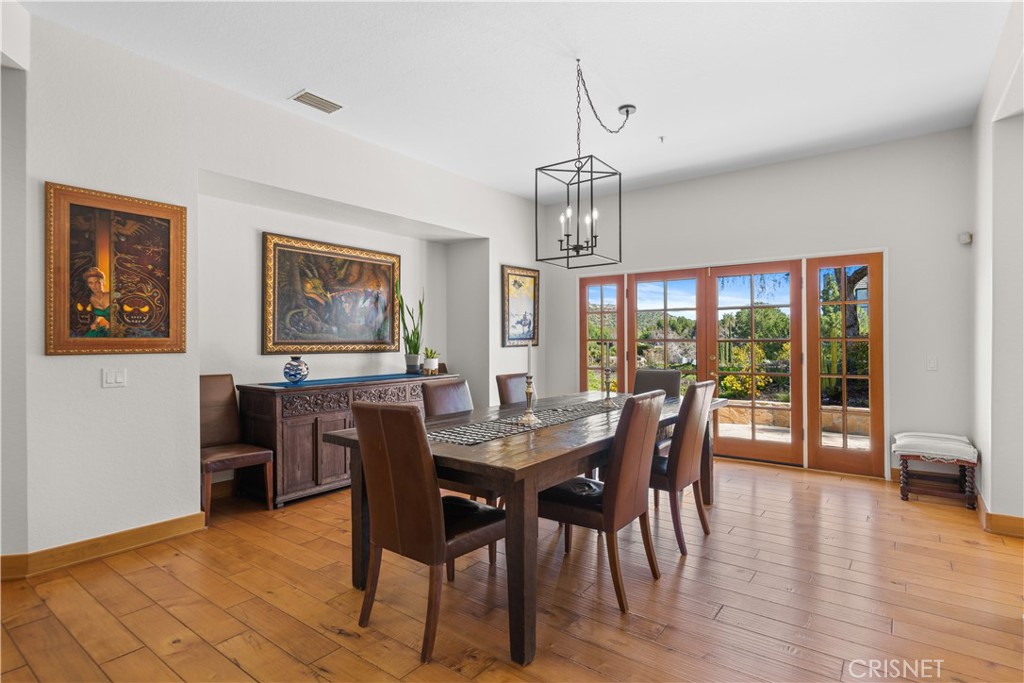 121 Saddlebow Road Bell Canyon, CA 91307 - Photo 19 of 62 a view of a dining room with furniture window and wooden floor