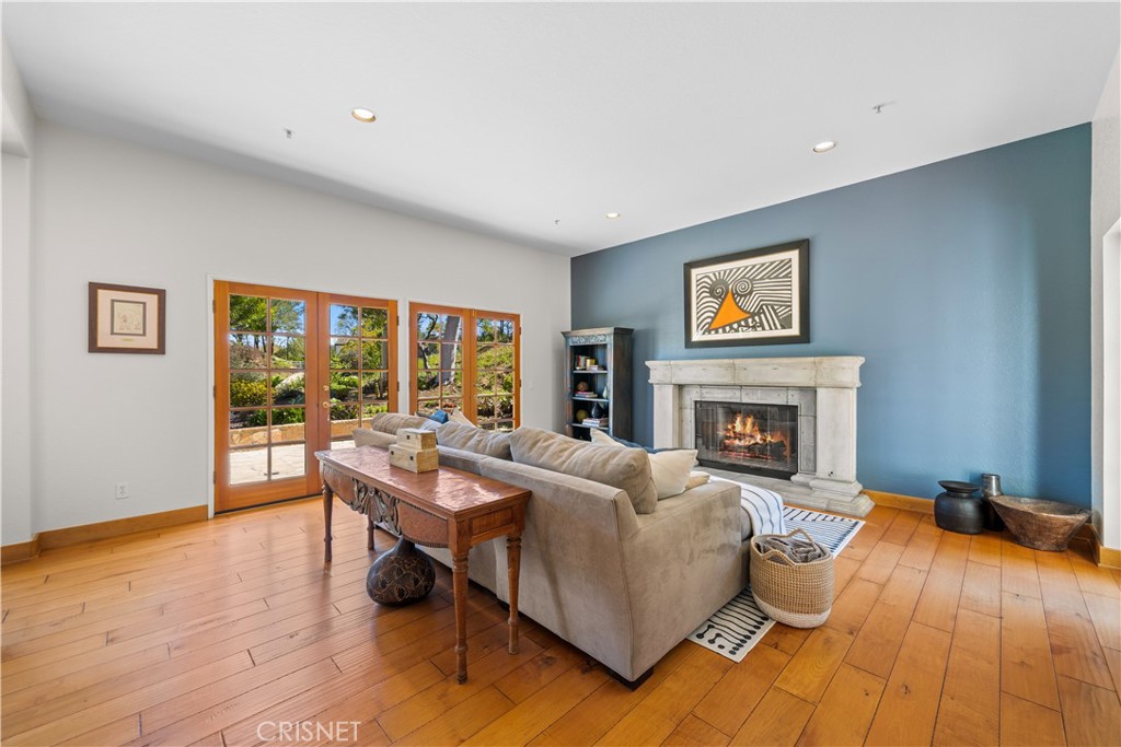 121 Saddlebow Road Bell Canyon, CA 91307 - Photo 20 of 62 a living room with furniture and a fireplace