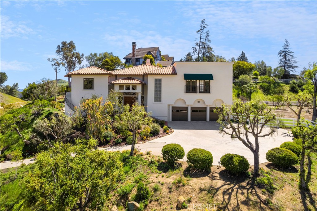 121 Saddlebow Road Bell Canyon, CA 91307 - Photo 2 of 62 a front view of a house with a yard
