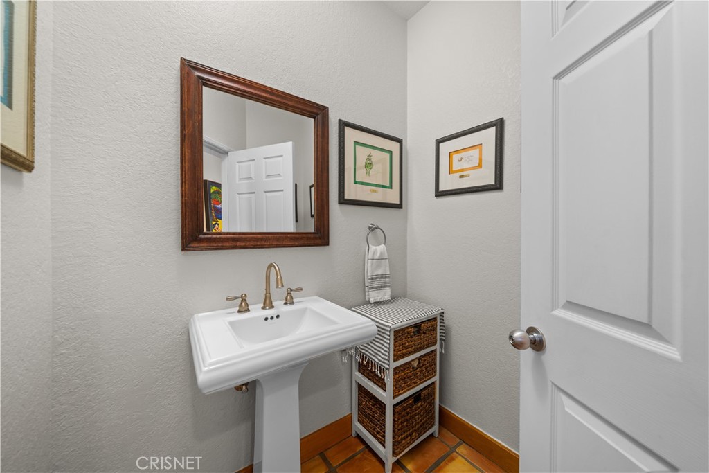 121 Saddlebow Road Bell Canyon, CA 91307 - Photo 23 of 62 a bathroom with a sink and a mirror