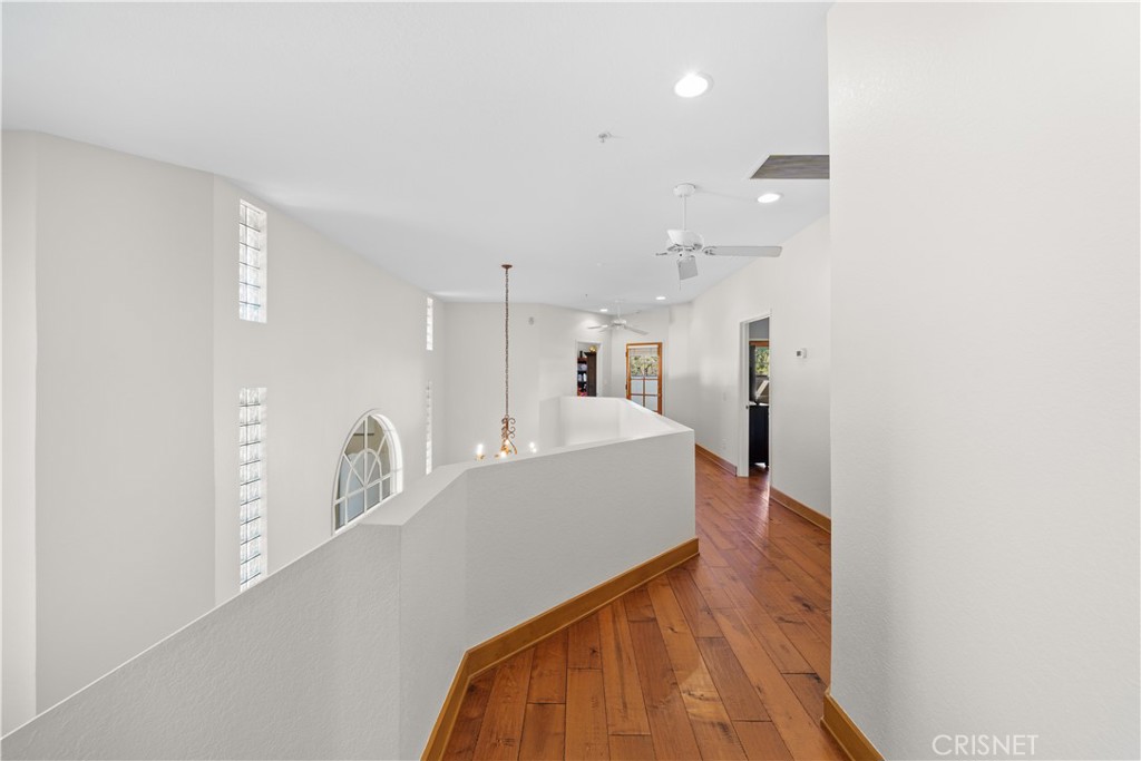 121 Saddlebow Road Bell Canyon, CA 91307 - Photo 27 of 62 a living room with kitchen island a sink cabinets and wooden floor