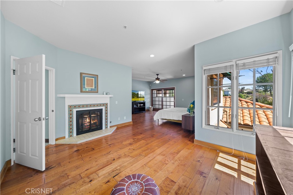 121 Saddlebow Road Bell Canyon, CA 91307 - Photo 32 of 62 a living room with furniture and a fireplace