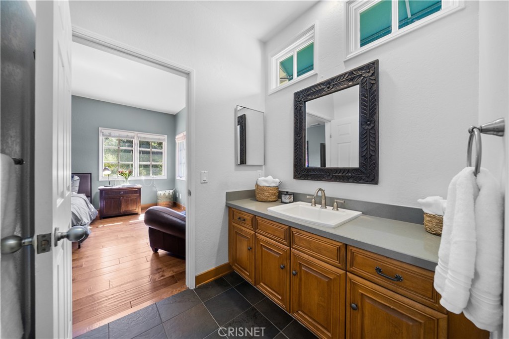 121 Saddlebow Road Bell Canyon, CA 91307 - Photo 41 of 62 a en suite bathroom with a double vanity sink a mirror and a shower