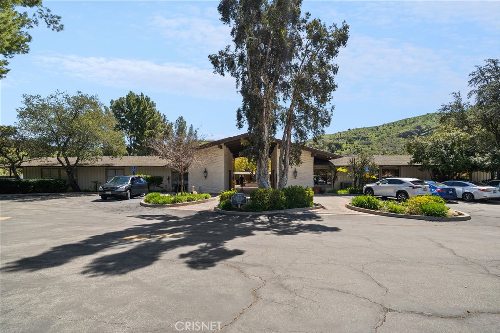 121 Saddlebow Road Bell Canyon, CA 91307 - Photo 59 of 62 a view of a house with a yard and garage