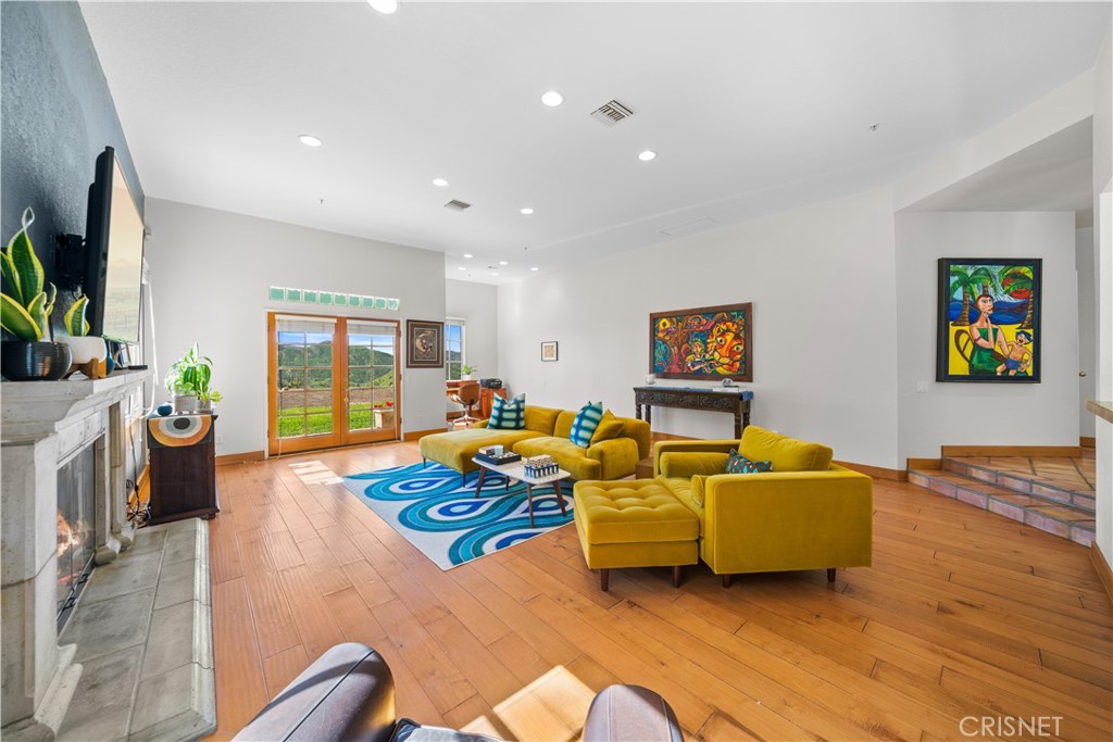 121 Saddlebow Road Bell Canyon, CA 91307 - Photo 10 of 62 a living room with furniture and a flat screen tv