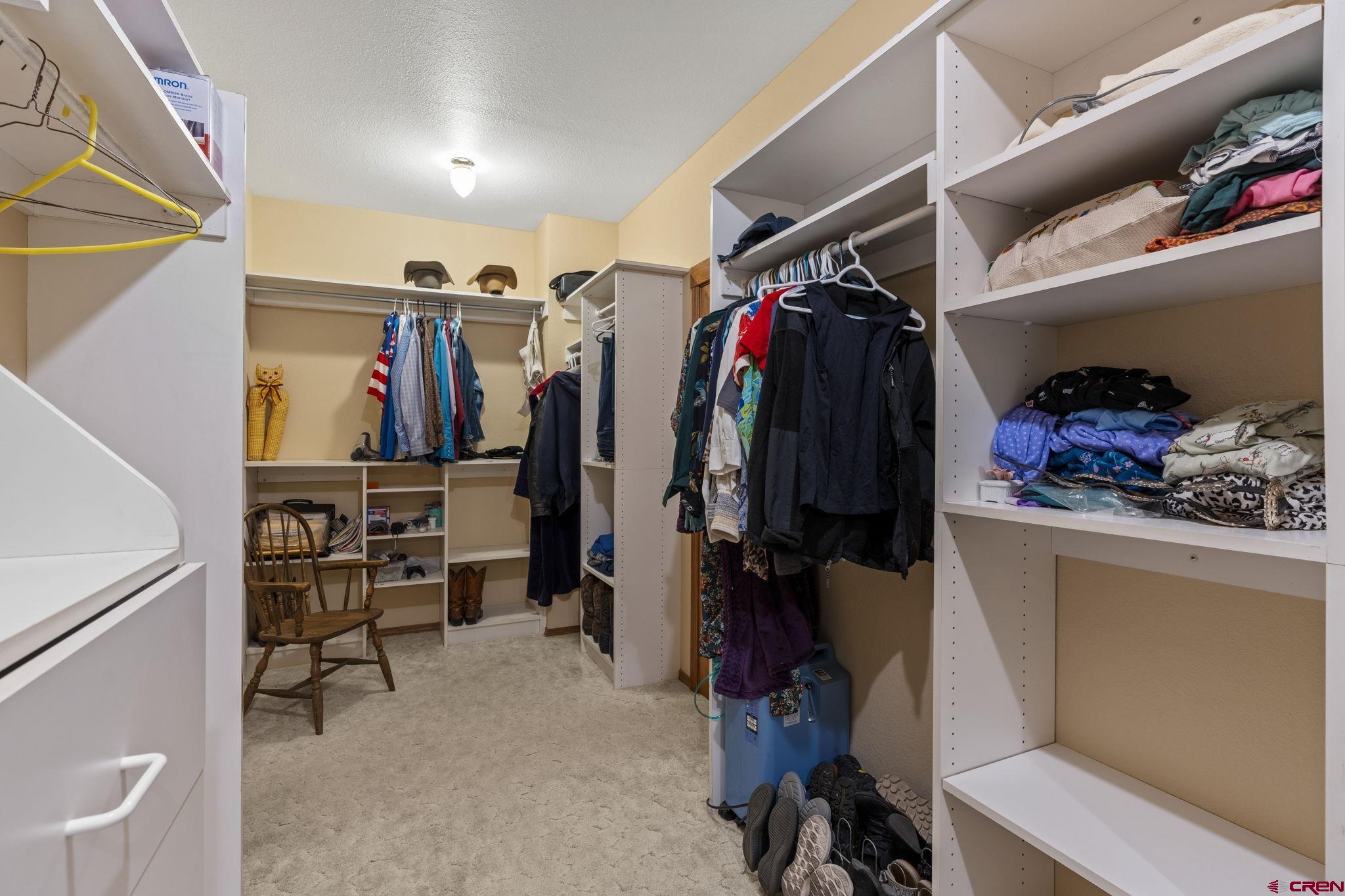 33140 Highway 550 Durango, CO 81301 - Photo 14 of 38 a view of walk in closet with clothes and shoes