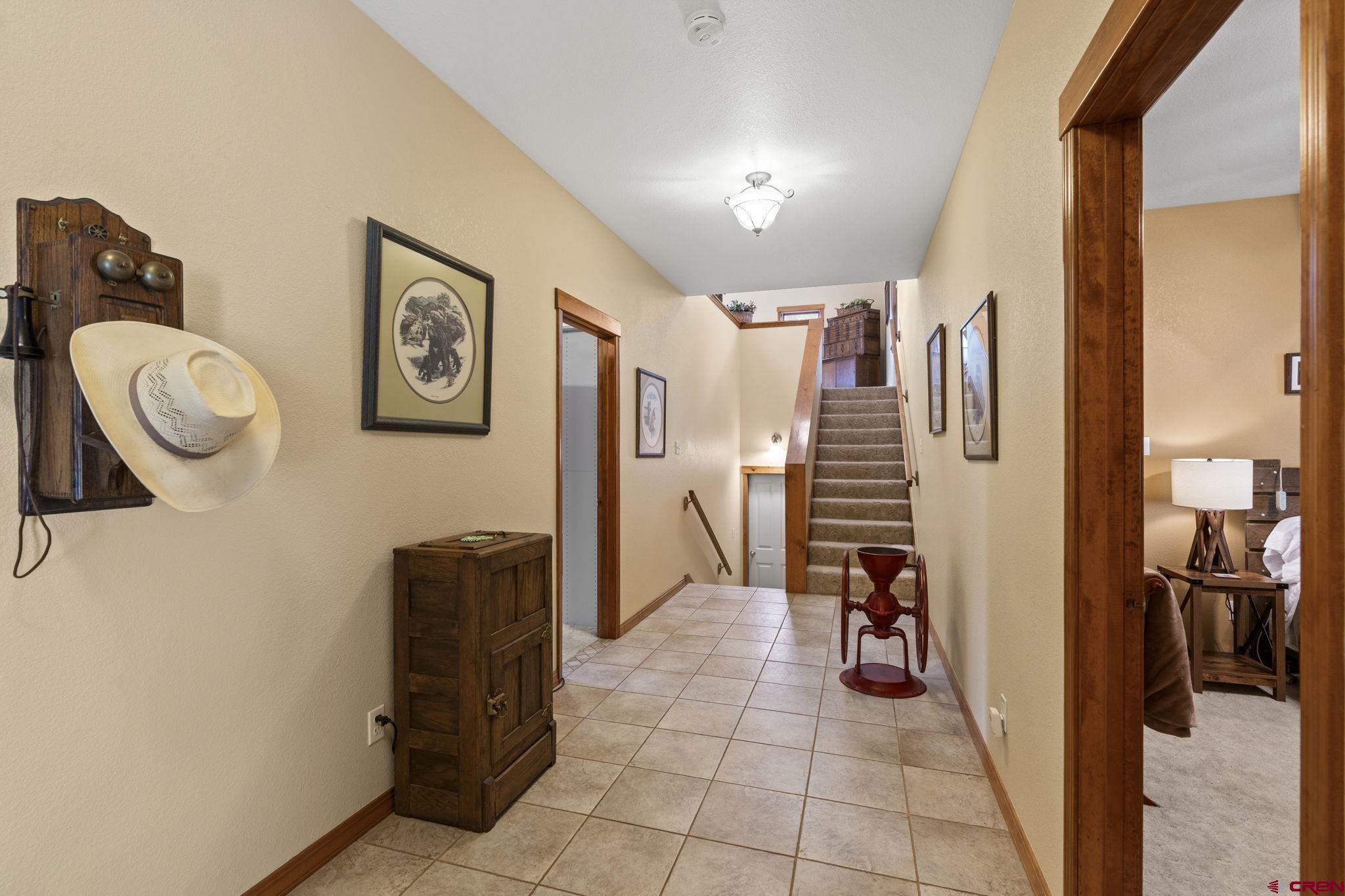 33140 Highway 550 Durango, CO 81301 - Photo 20 of 38 a view of a hallway with workspace and a couch