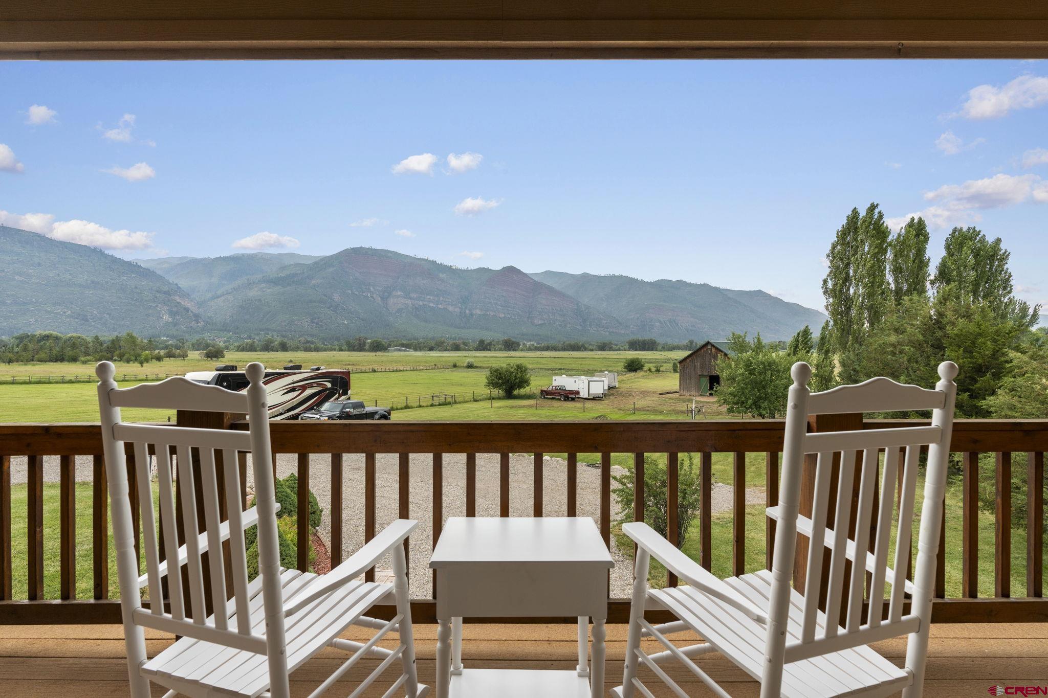33140 Highway 550 Durango, CO 81301 - Photo 24 of 38 a view of a balcony with wooden floor and fence