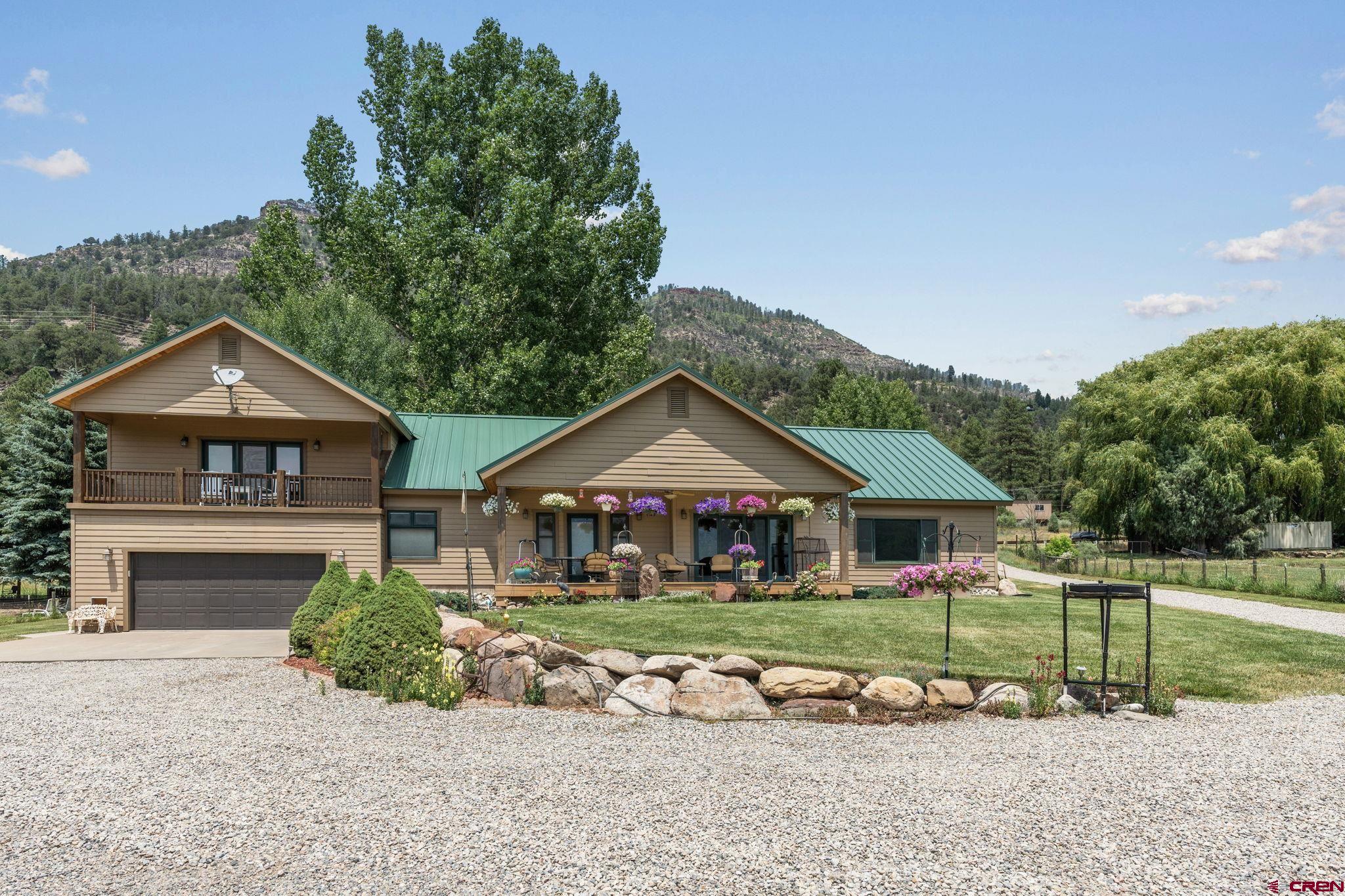 33140 Highway 550 Durango, CO 81301 - Photo 27 of 38 a front view of a house with garden