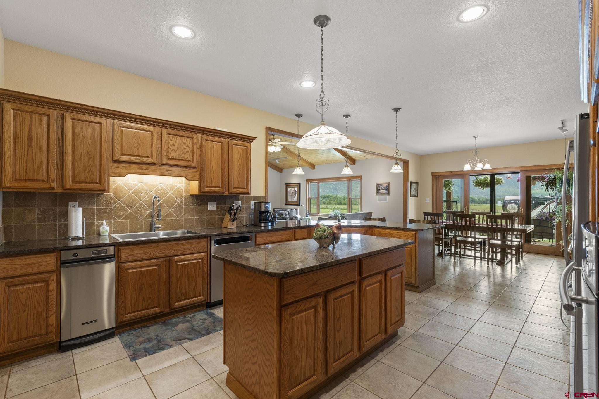 33140 Highway 550 Durango, CO 81301 - Photo 8 of 38 a kitchen with a sink a counter top space appliances and cabinets