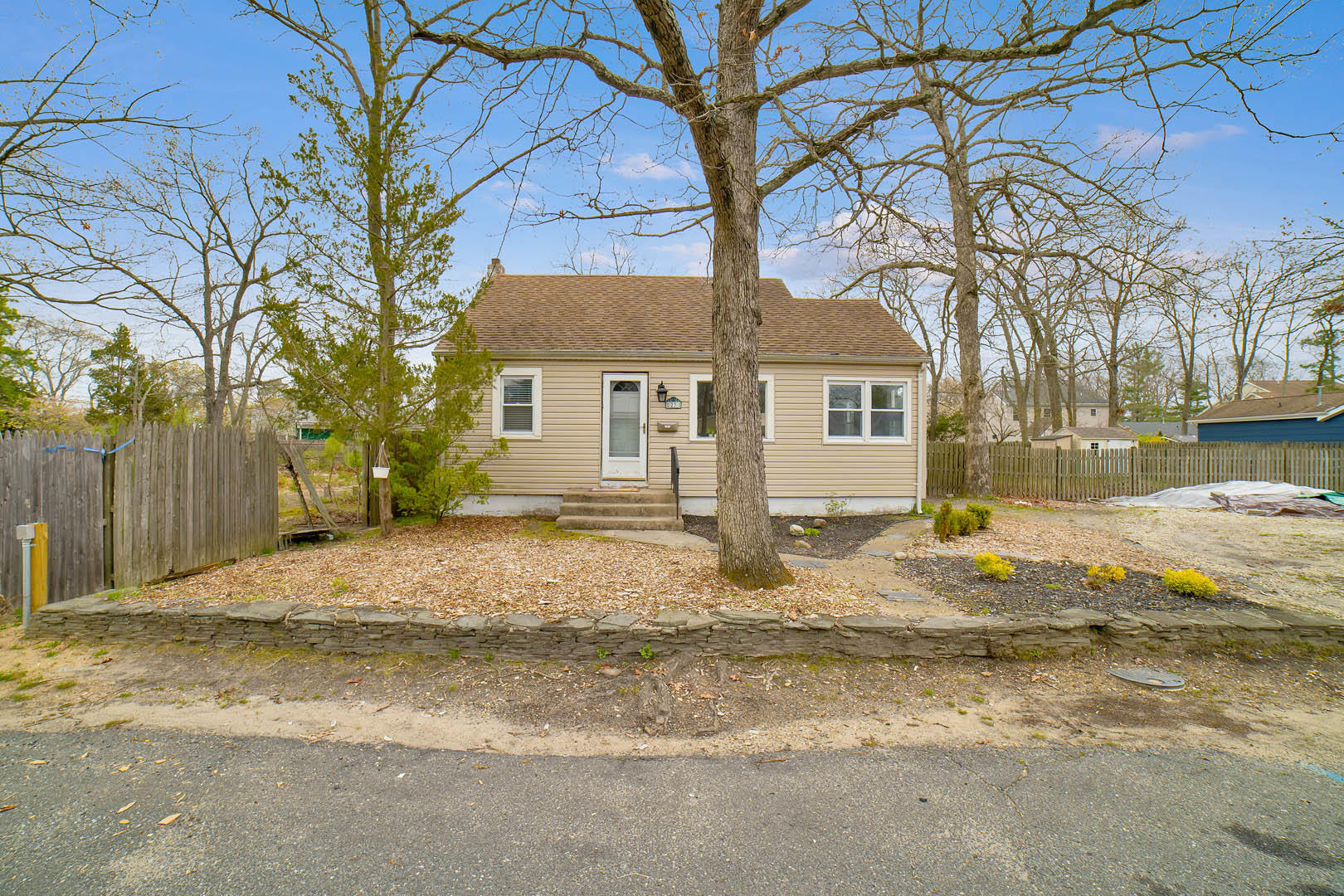 23 Stuyvesant Road Brick, NJ 08723 - Photo 1 of 18 a front view of a house with a yard and trees