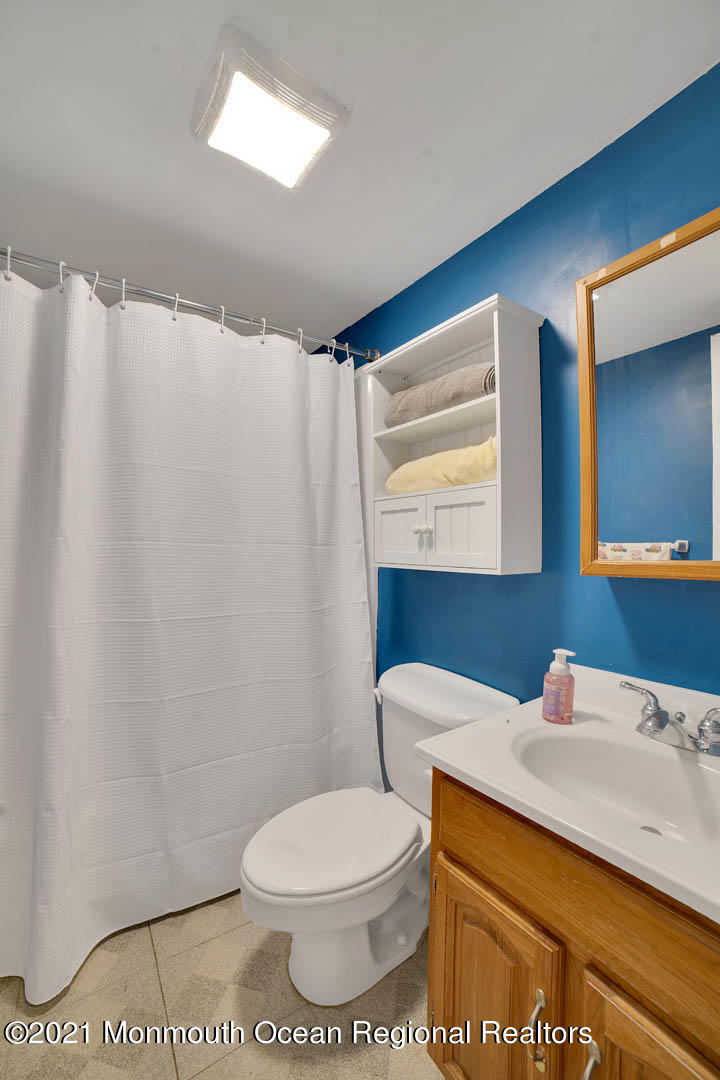 23 Stuyvesant Road Brick, NJ 08723 - Photo 11 of 18 a bathroom with a sink a toilet and mirror