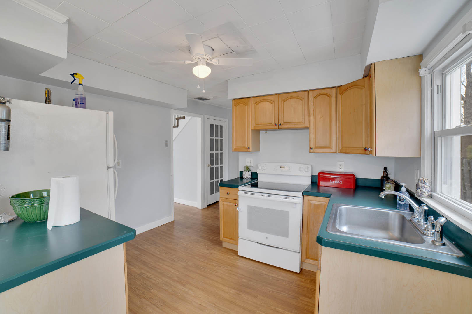 23 Stuyvesant Road Brick, NJ 08723 - Photo 7 of 18 a kitchen with granite countertop a sink dishwasher stove and refrigerator with wooden floor
