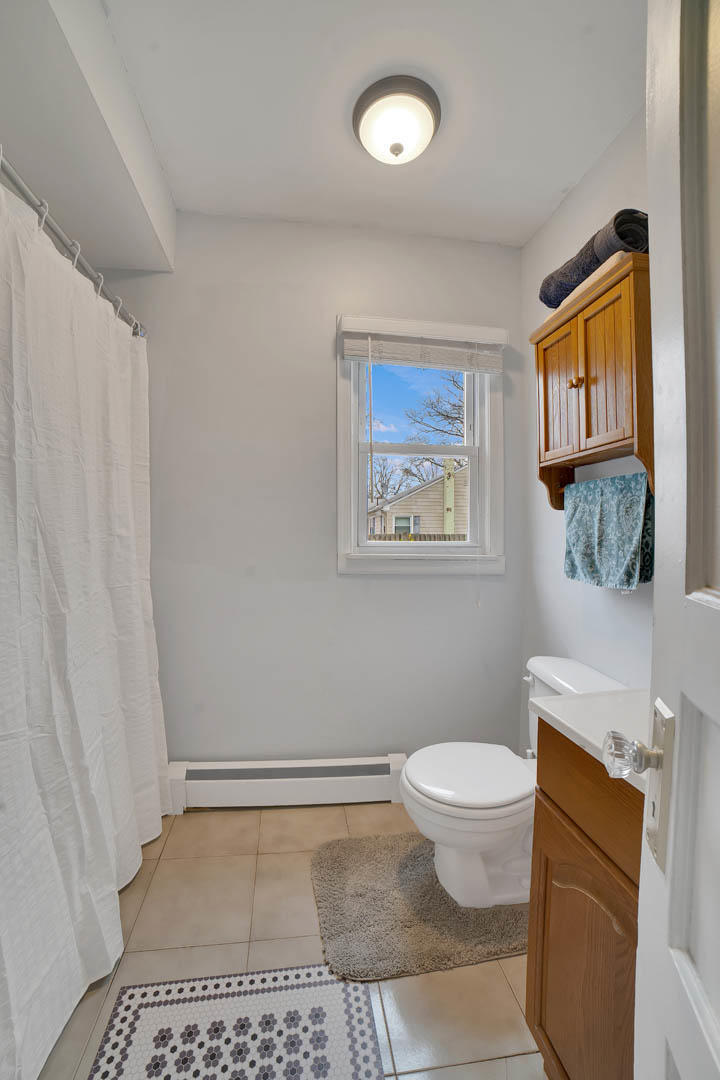 23 Stuyvesant Road Brick, NJ 08723 - Photo 9 of 18 a bathroom with a toilet a sink and a mirror