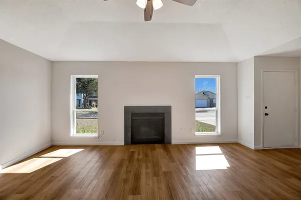 a kitchen with a refrigerator and a stove top oven