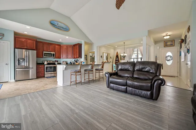 a view of kitchen with stainless steel appliances granite countertop lots of counter top space