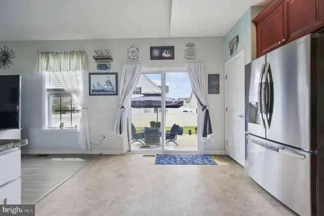 a view of kitchen with furniture and large window