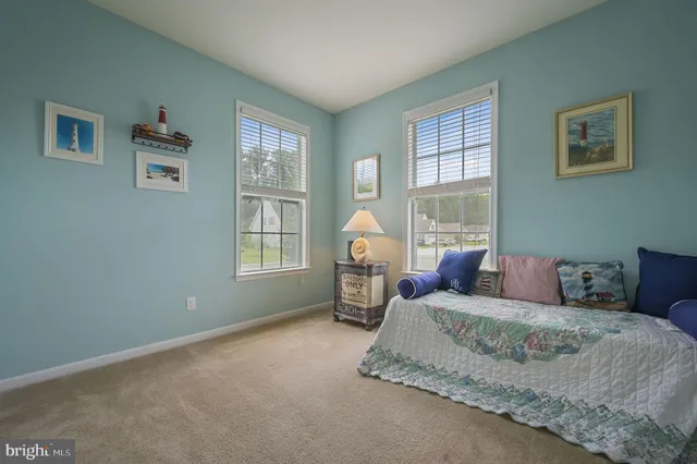 a bed room with a bed and a window