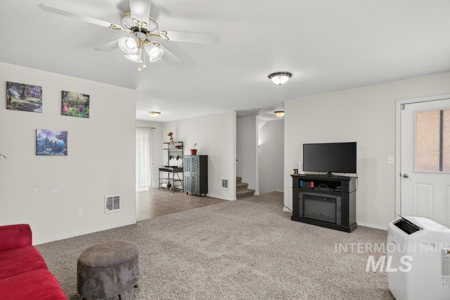 1337 Bristol Road Moscow, ID 83843 - Photo 6 of 28 Open-concept living area with neutral wall tones and a ceiling fan
