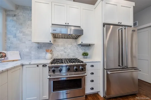a kitchen with a stove and a refrigerator