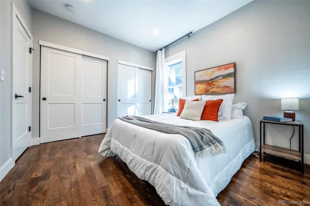 a bedroom with bed and window