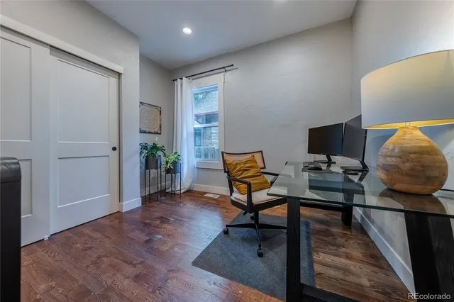 a workspace with furniture and wooden floor