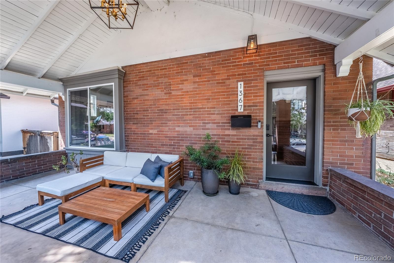 1367 Monroe Street Denver, CO 80206 - Photo 2 of 48 a backyard of a house with seating space