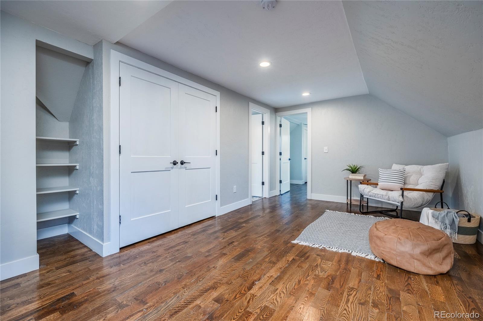 1367 Monroe Street Denver, CO 80206 - Photo 23 of 48 a living room with furniture and wooden floor
