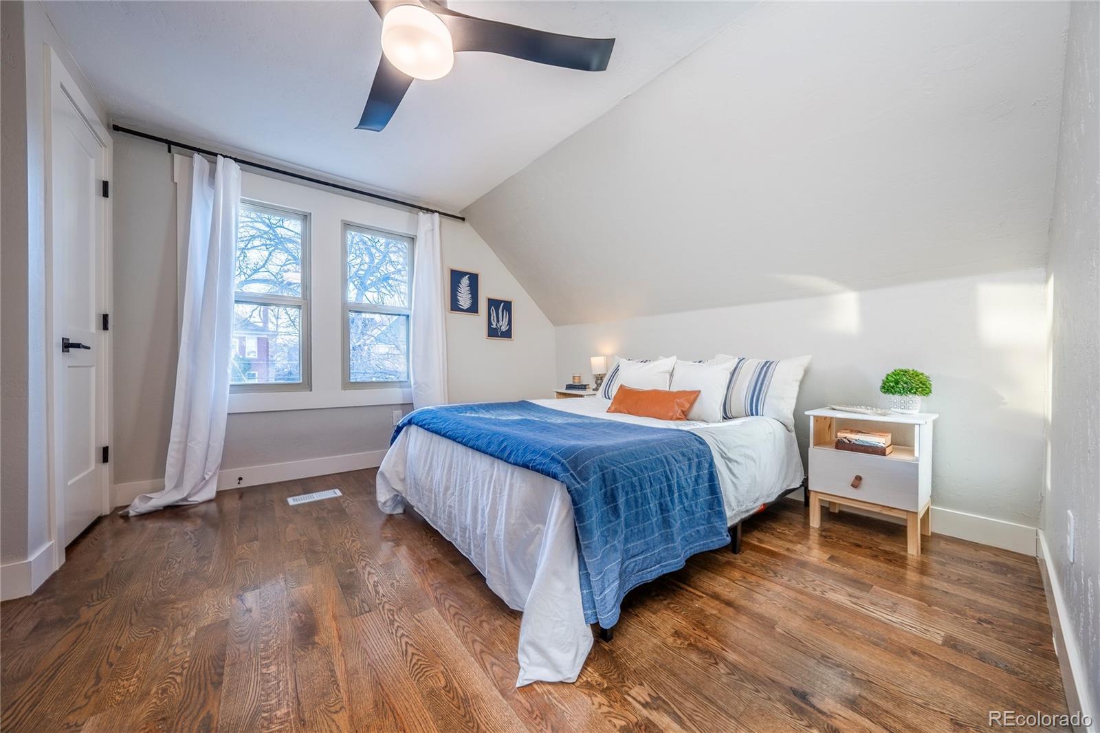 1367 Monroe Street Denver, CO 80206 - Photo 24 of 48 a bedroom with a bed and a window