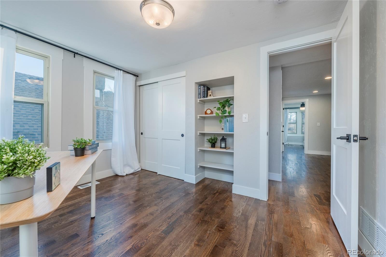 1367 Monroe Street Denver, CO 80206 - Photo 28 of 48 wooden floor in an empty room