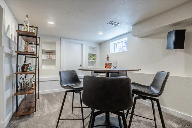 a work room with furniture and wooden floor
