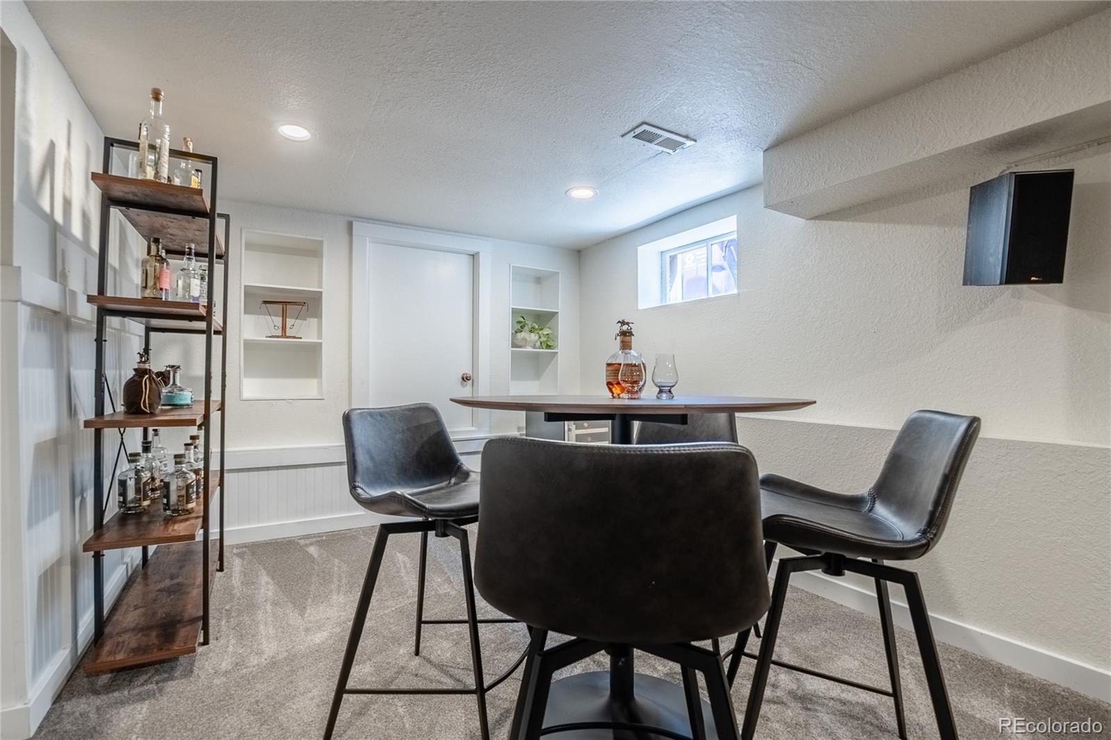 1367 Monroe Street Denver, CO 80206 - Photo 33 of 48 a work room with furniture and wooden floor